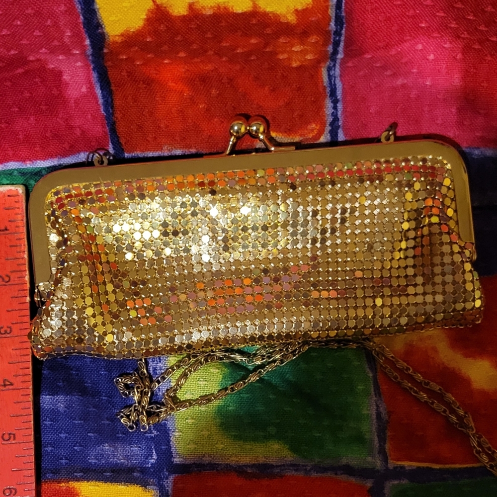 Jessica McClintock fancy gold metal purse.